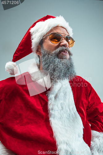 Image of Funny guy in christmas hat. New Year Holiday. Christmas, x-mas, winter, gifts concept.