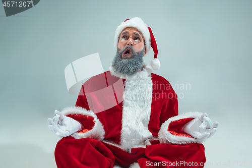 Image of Funny guy in christmas hat. New Year Holiday. Christmas, x-mas, winter, gifts concept.