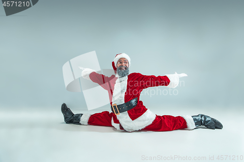 Image of Funny guy in christmas hat. New Year Holiday. Christmas, x-mas, winter, gifts concept.