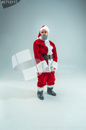 Image of Funny guy in christmas hat. New Year Holiday. Christmas, x-mas, winter, gifts concept.