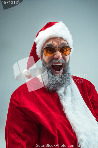 Image of Funny guy in christmas hat. New Year Holiday. Christmas, x-mas, winter, gifts concept.