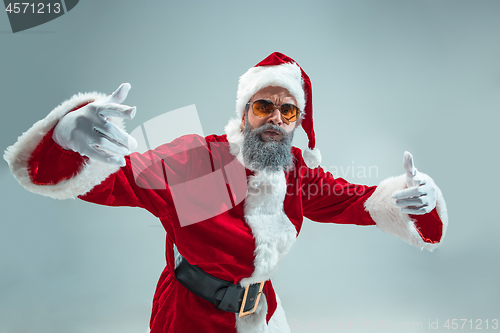 Image of Funny guy in christmas hat. New Year Holiday. Christmas, x-mas, winter, gifts concept.