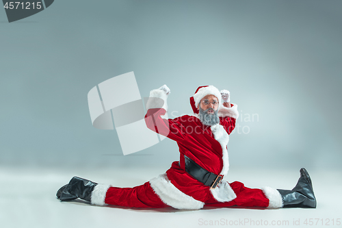 Image of Funny guy in christmas hat. New Year Holiday. Christmas, x-mas, winter, gifts concept.