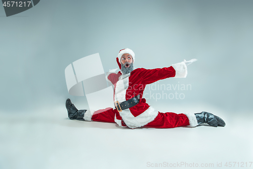 Image of Funny guy in christmas hat. New Year Holiday. Christmas, x-mas, winter, gifts concept.