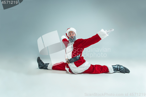 Image of Funny guy in christmas hat. New Year Holiday. Christmas, x-mas, winter, gifts concept.