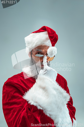 Image of Funny guy in christmas hat. New Year Holiday. Christmas, x-mas, winter, gifts concept.