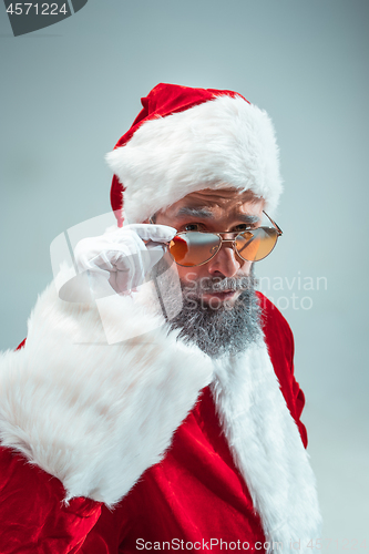 Image of Funny guy in christmas hat. New Year Holiday. Christmas, x-mas, winter, gifts concept.