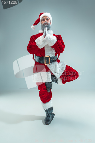 Image of Funny guy in christmas hat. New Year Holiday. Christmas, x-mas, winter, gifts concept.