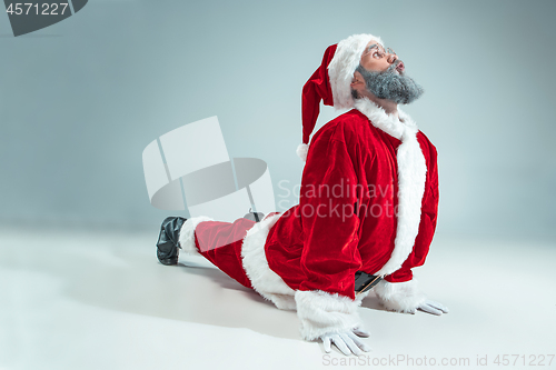 Image of Funny guy in christmas hat. New Year Holiday. Christmas, x-mas, winter, gifts concept.