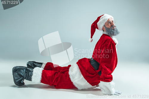 Image of Funny guy in christmas hat. New Year Holiday. Christmas, x-mas, winter, gifts concept.