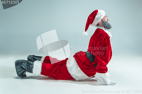 Image of Funny guy in christmas hat. New Year Holiday. Christmas, x-mas, winter, gifts concept.