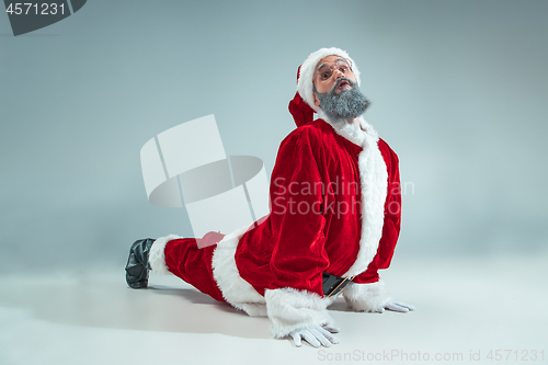 Image of Funny guy in christmas hat. New Year Holiday. Christmas, x-mas, winter, gifts concept.