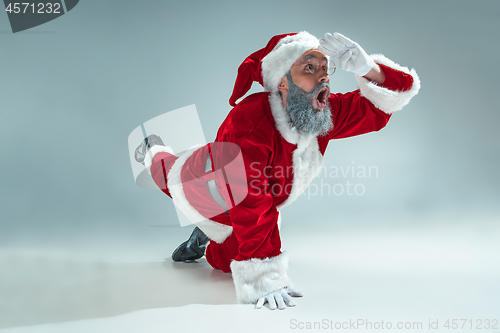 Image of Funny guy in christmas hat. New Year Holiday. Christmas, x-mas, winter, gifts concept.