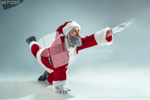 Image of Funny guy in christmas hat. New Year Holiday. Christmas, x-mas, winter, gifts concept.