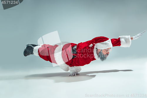 Image of Funny guy in christmas hat. New Year Holiday. Christmas, x-mas, winter, gifts concept.