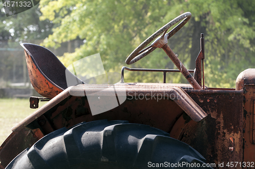 Image of Oold, rusted, abandoned tractor.