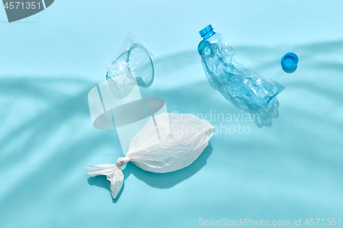 Image of Ocean plastic garbage in a shadows waves from polyethylene foil.