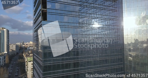 Image of Glass office building and view of the modern city with passing cars and railway. 4K video, 240fps, 2160p.