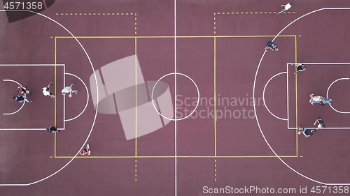 Image of Men play basketball on the brown field. 4K video, 240fps, 2160p.