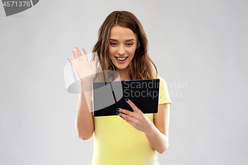 Image of teenage girl having video call on tablet computer