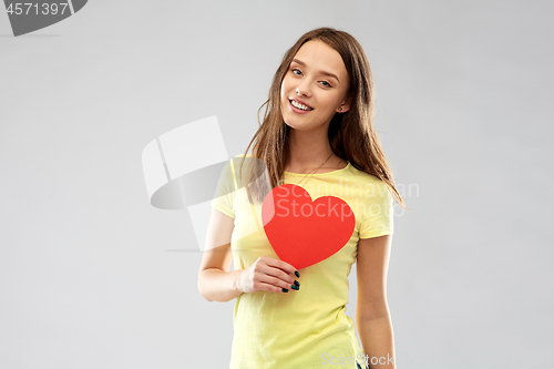 Image of smiling teenage girl with red heart