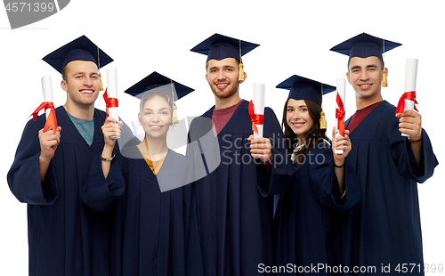 Image of graduates in mortar boards with diplomas