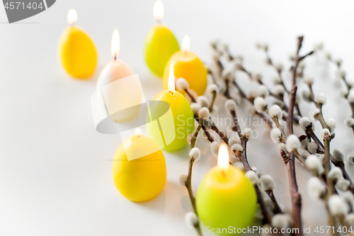 Image of pussy willow branches and easter egg candles