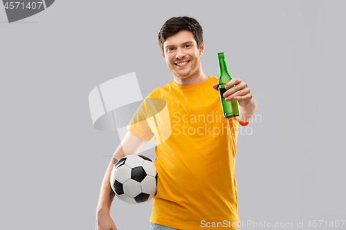 Image of man or football fan with soccer ball and beer