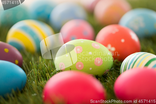 Image of colored easter eggs on artificial grass