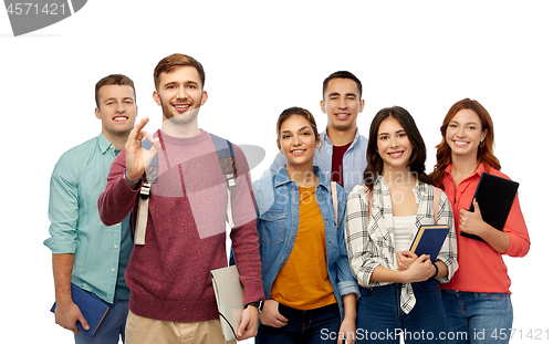 Image of group of smiling students showing ok hand sign