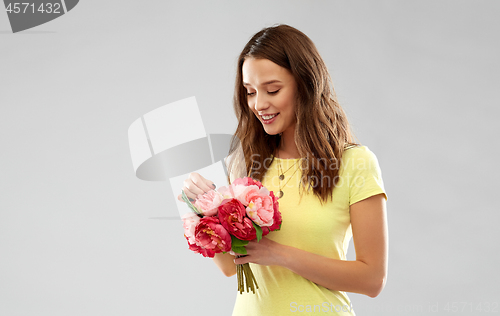 Image of young woman or teenage girl with flower bouquet