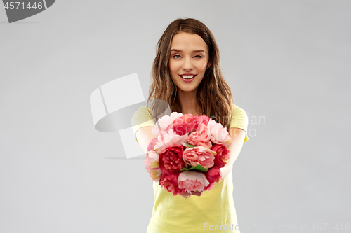 Image of young woman or teenage girl with flower bouquet