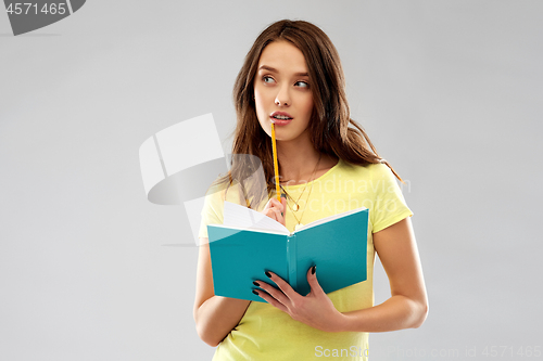 Image of teenage student girl with diary or notebook