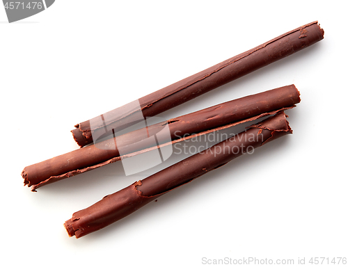 Image of chocolate sticks on white background