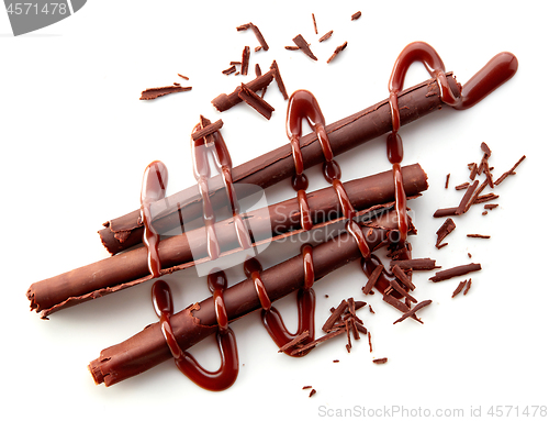 Image of chocolate sticks on white background