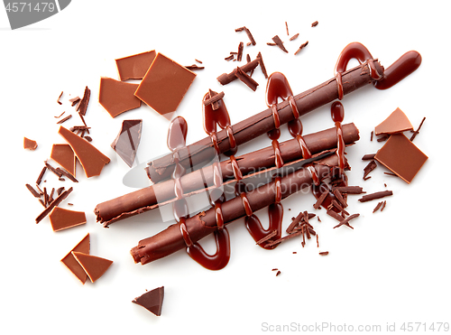 Image of chocolate sticks on white background