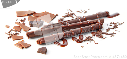 Image of chocolate sticks on white background