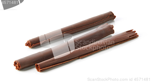 Image of chocolate sticks on white background