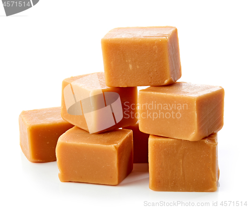 Image of caramel candies on white background