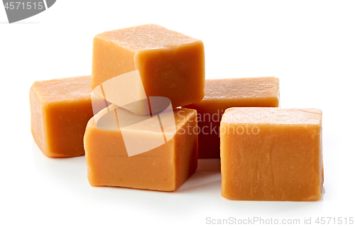 Image of caramel candies on white background