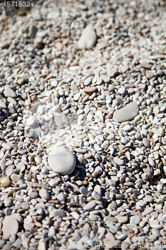 Image of Abstract background with grey and white peable stones.