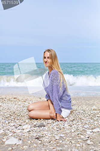 Image of Beautiful happy girl on the Adriatic beach. Travel and vacation.