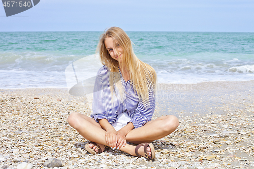 Image of Beautiful happy girl on the Adriatic beach. Travel and vacation.