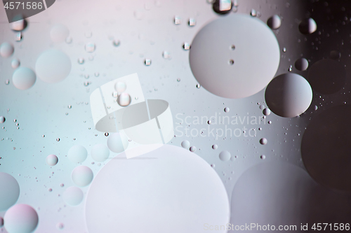 Image of Defocused pastel and dark colored abstract background picture made with oil, water and soap