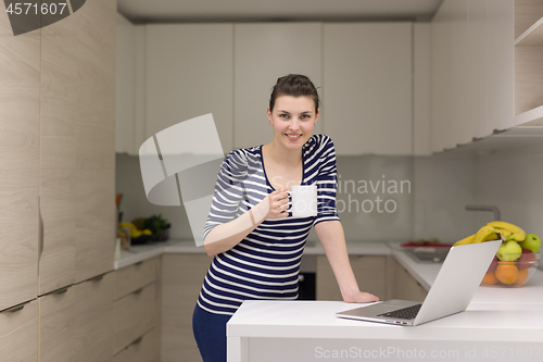 Image of woman drinking coffee enjoying relaxing lifestyle