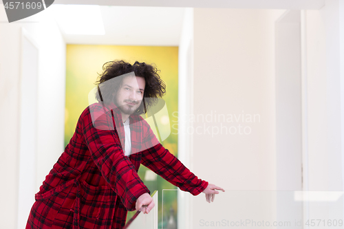 Image of portrait of young man in bathrobe