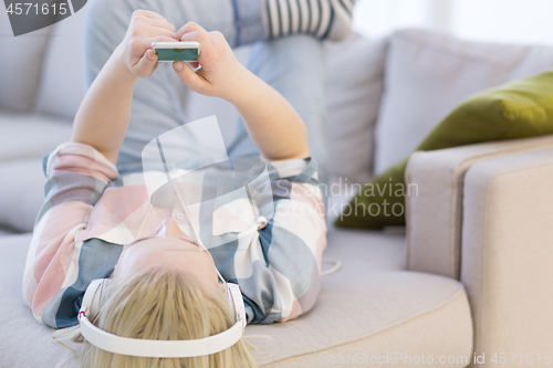 Image of girl enjoying music through headphones