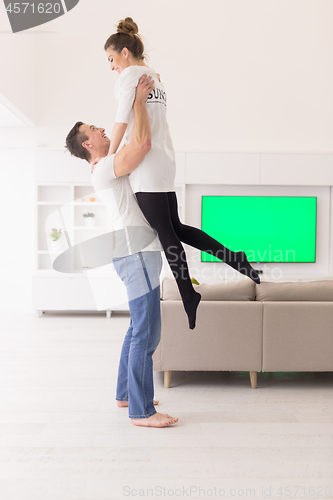 Image of couple hugging in their new home