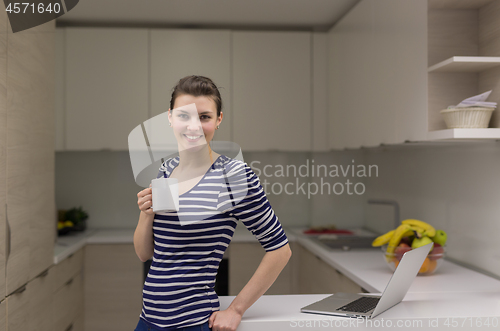 Image of woman drinking coffee enjoying relaxing lifestyle