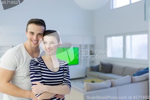 Image of couple hugging in their new home